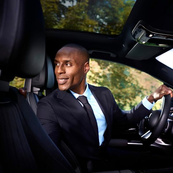 Chauffeur opening the car door